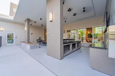 an open kitchen and dining area of a house at Devereaux Miami Luxury 2 Bedroom Apartment in Biscayne Gardens