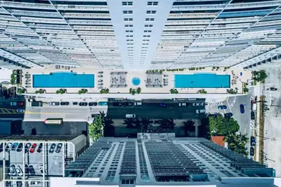 a large white building with a large ceiling at Top Floor Front Facing Penthouse With Breathtaking Views in Miami