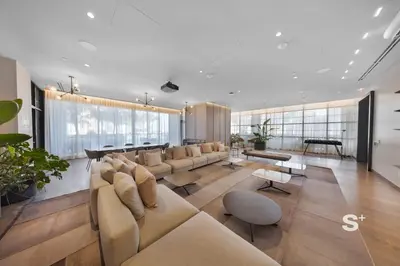a large living room with a couch and a piano at Stylish City Condo in the Heart of Downtown Miami in Miami