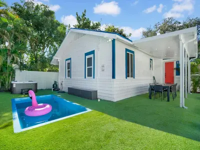a small backyard with a pink inflatable swimming pool at Bungalow House 6 BR Pool Little Havana in Miami