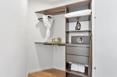 a closet with a shelf and a microwave at MVR Stunning Views Superhost Service in Miami