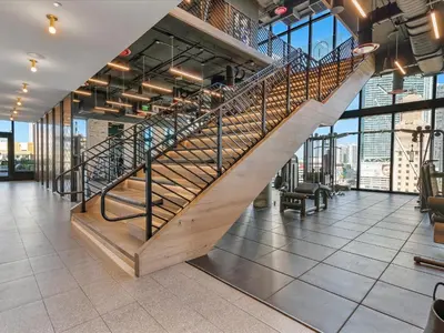 a spiral staircase in a building with a lobby at MVR Stunning Views Superhost Service in Miami