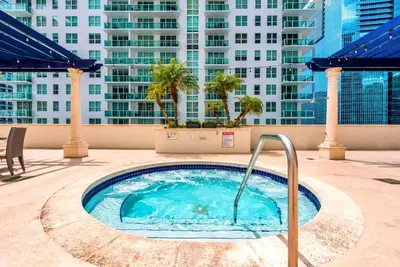 a hot tub on the roof of a building at Enjoy Pool and Stunning City Views in Brickell in Miami