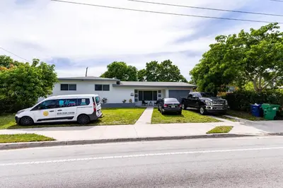 a white van parked in front of a house at Stylish 3BR Home - BBQ & Near Top Attractions in Miami Gardens