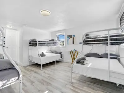 a bedroom with two bunk beds in it at Villa Bonita 6BR Pool Hot Tub Game Room in Miami