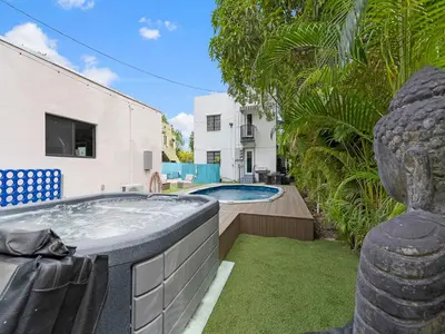a hot tub in the backyard of a house at Villa mi Amor Walkable Pool & Games in Miami