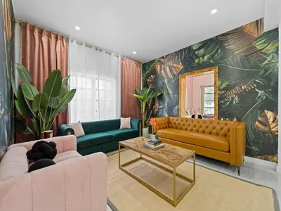 a living room with a couch and a table at Villa mi Amor Walkable Pool & Games in Miami