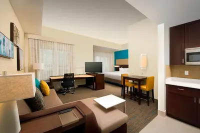 a hotel room with a bed and a desk at Residence Inn by Marriott Miami Airport West/Doral in Miami