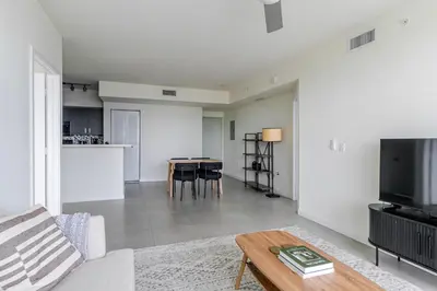 a living room with a couch and a table at Blueground Riverside pool nr Miami River MIA-155 in Miami