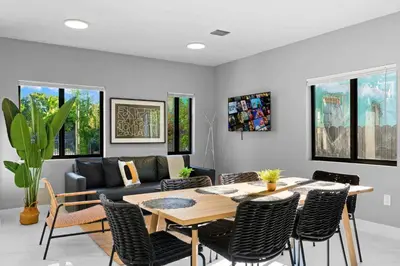a living room with a table and a couch at Comfortable Townhouse - Free Parking Included in Miami