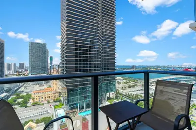 a balcony with a view of a city at High-Rise Luxury Condo in Downtown Miami with Ocean Views in Miami