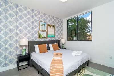 a bedroom with a bed and a window at MetroPark Hotel in Miami