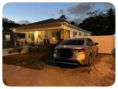 a car parked in front of a house at Suite in Dania Beach in Dania Beach
