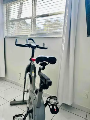 a bike parked in a room with a window at Villa Las Olas Designed with you in mind! in Fort Lauderdale