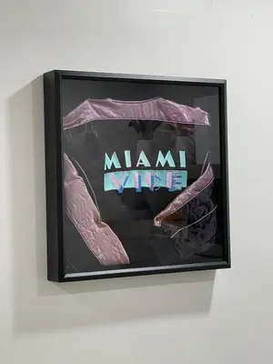 a framed picture of a miami vice sign on a wall at The Vice City Suite - Private stay with Free Parking in the Heart of Miami in Miami