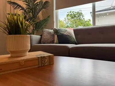 a living room with a couch and a table at The Miami Tropic Suite - Private Stay with Free Parking in the Heart of Miami in Miami