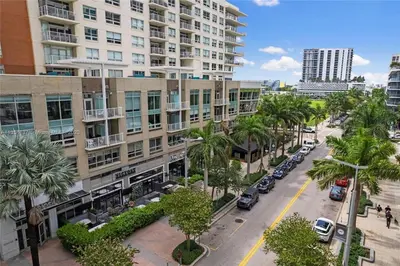 an aerial view of a street with palm trees and buildings at Midtown Miami Getaway-with pool n parking in Miami