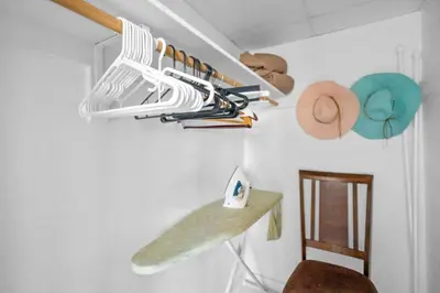 a room with a surfboard hanging on a wall at 1BED Condo w/Pool View | 3rd Floor at Tides in Hollywood