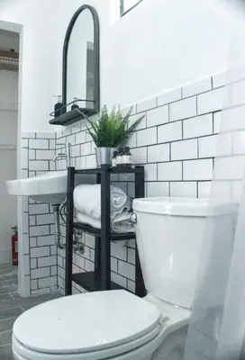 a bathroom with a toilet and a sink at The Havana Nights Guesthouse - Private Stay with Free Parking in the Heart of Miami in Miami