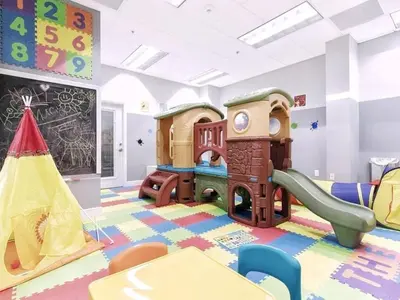 a childrens play room with a slide and play equipment at Newly Renovated 3BR Condo with Bay Views and Parking in Miami