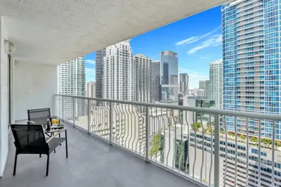 a balcony with a view of a city skyline at Newly Renovated 1BR APT with Pool, Gym, and WFH in Miami