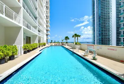 a swimming pool in the middle of a building at Comfortable Brickell Studio - City View & Free Parking in Miami