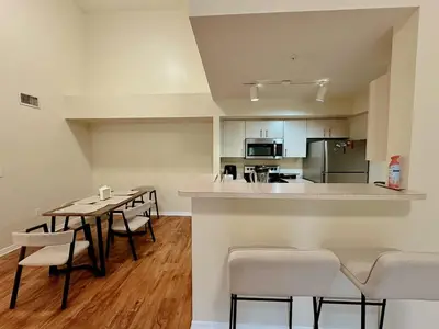 a kitchen and dining room with a table and chairs at 1B - 1B Apartment for 3 at Pembroke Pines in Pembroke Pines