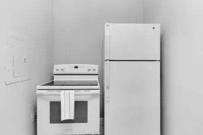 a kitchen with a stove and a refrigerator at 427 NE 107th Studio · 6BR 3BA 7 Beds Pool Parking 2 Kitchen in Miami Shores