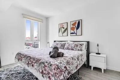 a bedroom with a bed with a stuffed animal on it at Modern 1BR Apt In Edgewater Free Parking in Miami