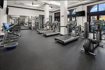 a gym with several treadmills and machines at Landing Spectacular 1BD Gym Clubhouse in Miramar