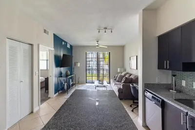 a kitchen and living room with a couch and a table at Landing Spectacular 1BD Gym Clubhouse in Miramar