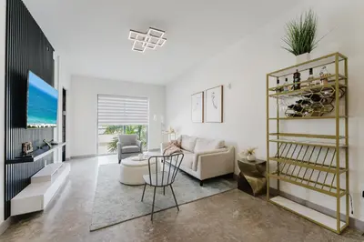 a living room with a couch and a table at KOOSH - Boutique Aparthotel in Fort Lauderdale