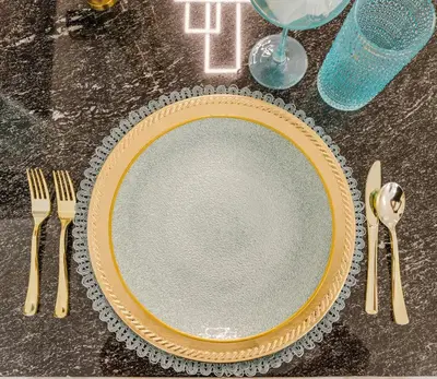a table with a plate and cutlery on it at KOOSH - Boutique Aparthotel in Fort Lauderdale