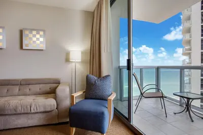 a living room with a couch and a table at Marenas Beach Resort Private Luxury Suites in Miami Beach