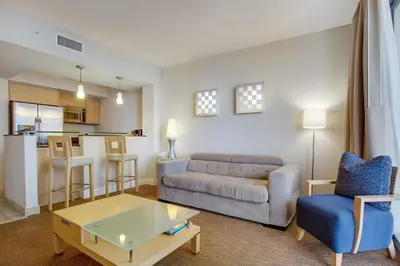 a living room with a couch and a table at Marenas Beach Resort Private Luxury Suites in Miami Beach