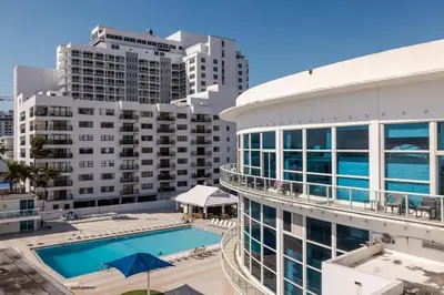 an aerial view of a building with a swimming pool at Shine Suites Balcony Studio 7 in Miami Beach