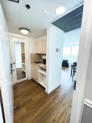an open kitchen and dining room in a apartment at Shine Suites Studio 11 in Miami Beach