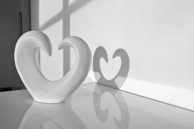 two white hearts sitting on top of a table at Amazing 1bed on Hollywood Beach Boardwalk W Pool in Hollywood