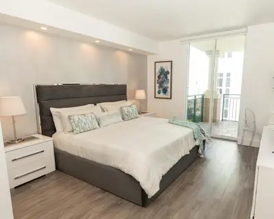 a bedroom with a large bed and a large window at The CAROLINE I at King David in Sunny Isles Beach in Sunny Isles Beach