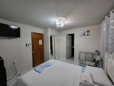 a bedroom with a bed and a television in it at Paseo Miami in Miami