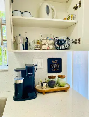 a kitchen counter with a coffee maker on a shelf at Balcony 2BR Apartment with Free Parking near Freedom Park & Brickell in Miami