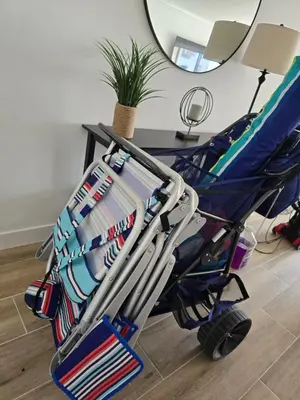 a stroller filled with hockey equipment in a room at 2BR-2BA with Pool Gym Beach Marbella Tower in Sunny Isles Beach
