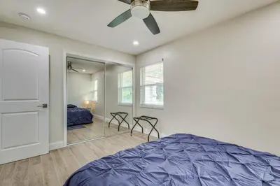 a bedroom with a bed and a ceiling fan at Backyard Oasis Fort Lauderdale Home Near Beach in Fort Lauderdale