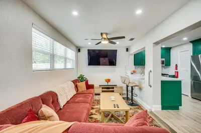 a living room with a couch and a table at Backyard Oasis Fort Lauderdale Home Near Beach in Fort Lauderdale