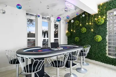 a room with a ping pong table and a green wall at NEW Hollywood Luxury Villa, Game Room, Hot Tub 12, Fire Pit & BBQ in Hollywood