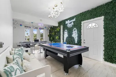 a room with a pool table and ping pong ball at NEW Hollywood Luxury Villa, Game Room, Hot Tub 12, Fire Pit & BBQ in Hollywood