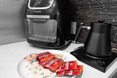 a plate of food on a counter next to a toaster at Cozy Studio in Brickell free parking in Miami