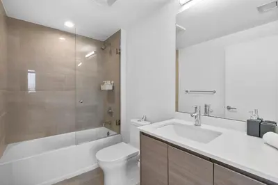 a bathroom with a sink and a toilet and a shower at Luxury Pent House Suite with Downtown Views in Miami