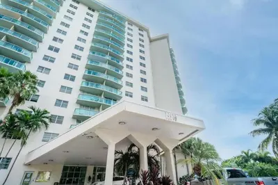 a large apartment building with a large building at Luxury Beach & City View Condo 5 min walk to beach in Sunny Isles Beach