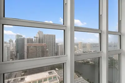a view of a city skyline from an office window at 47th-Floor Brickell Condo with City Views and Pool in Miami